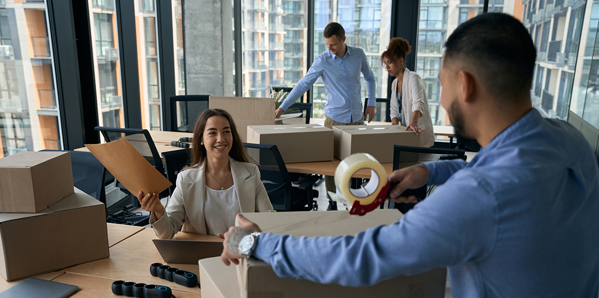 Team of coworkers preparing for office move